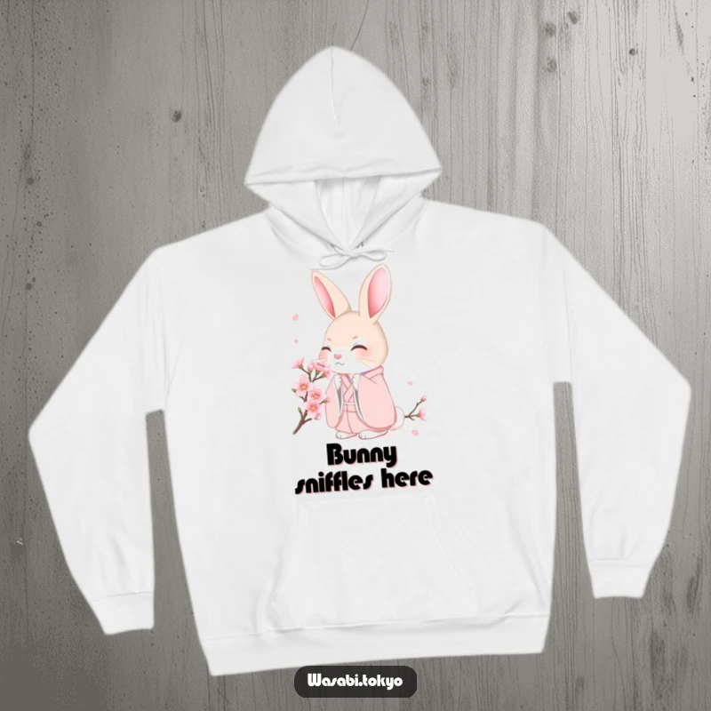 Funny shy rabbit in a pink kimono surrounded by cherry blossoms on a cozy hoodie, a sweet and funny gift.