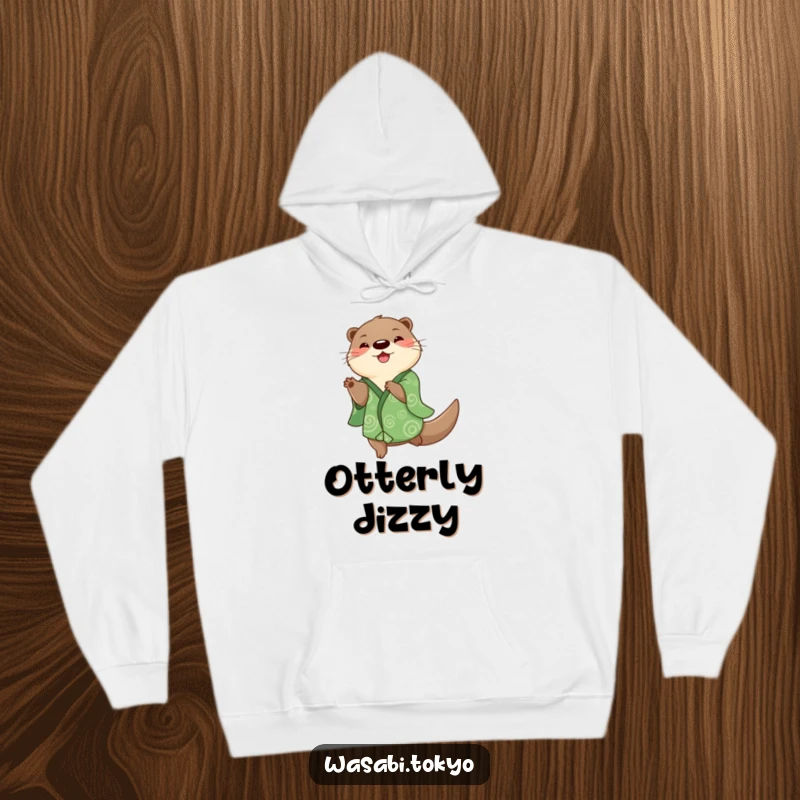 Funny otter in a green kimono spinning happily on a cozy hoodie, bringing playful energy and humor, a great funny gift.